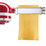 Gvode stainless steel pasta roller attachment rolling a wide pasta sheet from red stand mixer