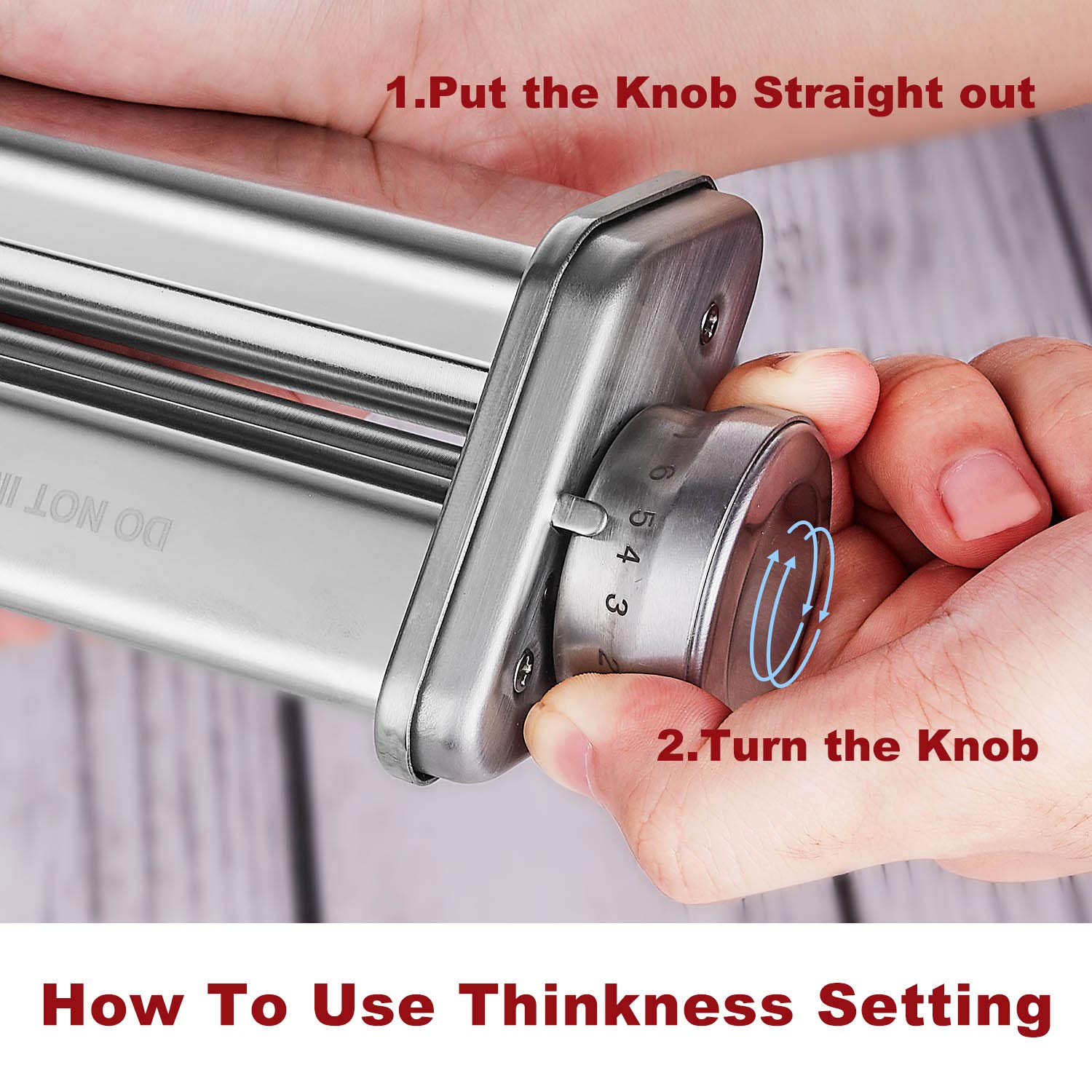 Hand pulling and turning numbered knob to adjust pasta roller thickness