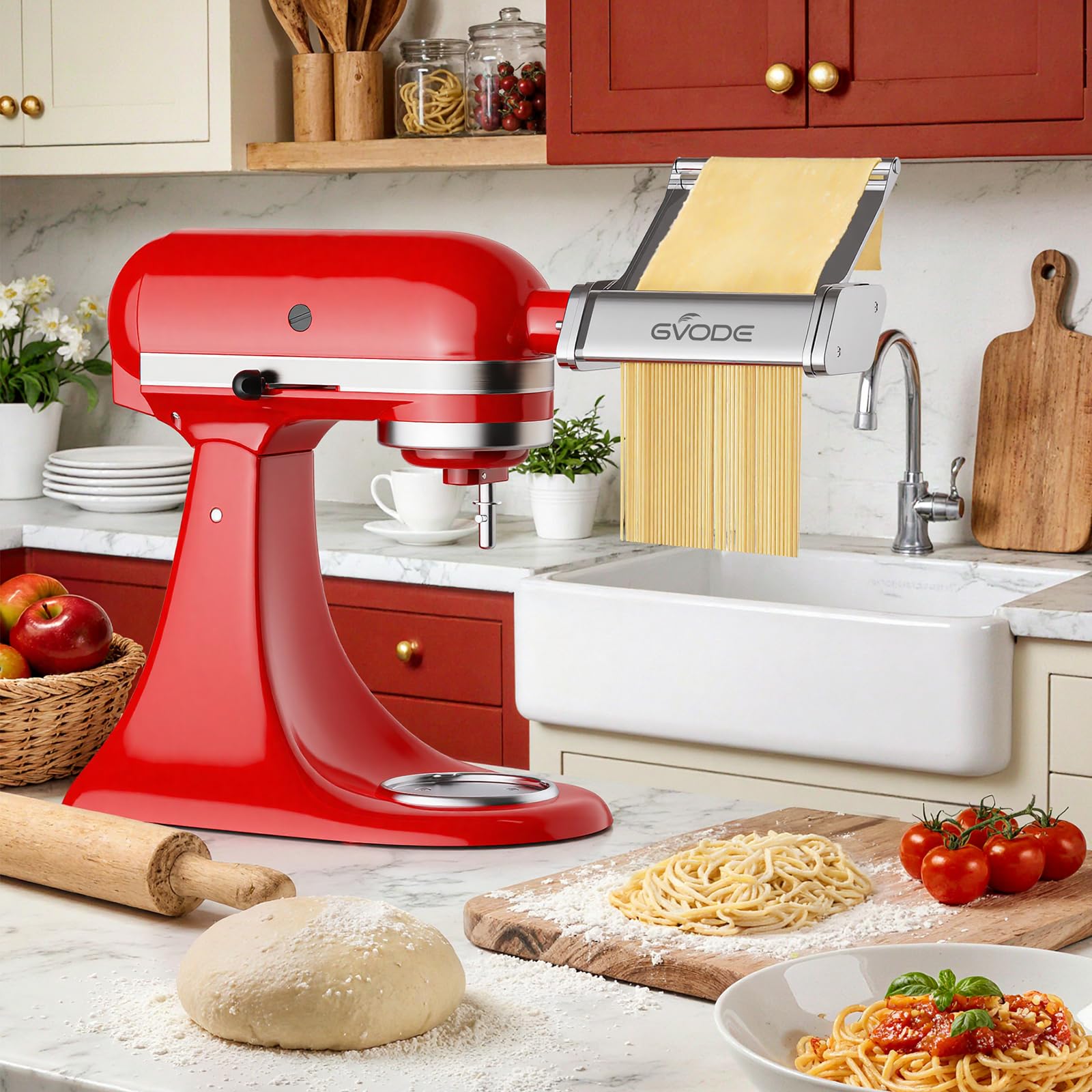 Gvode pasta attachment cutting noodles on red stand mixer beside dough and finished pasta