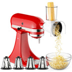 Gvode slicer-shredder attachment on red stand mixer with four cutting cones and shredded cheese