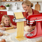 Woman and child rolling pasta with Gvode attachment on red stand mixer
