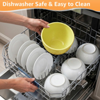 Yellow silicone bowl liner being loaded into dishwasher beside dishes