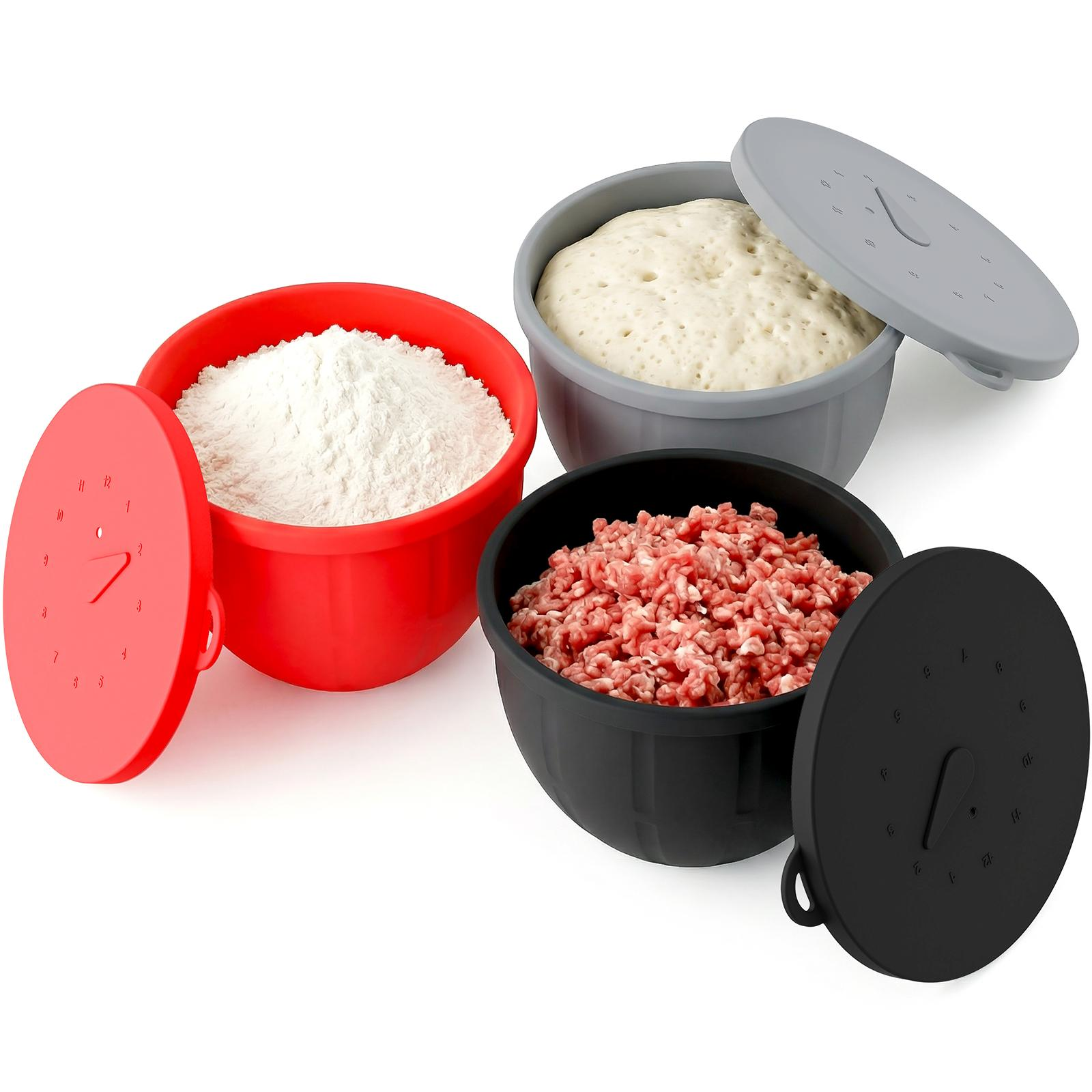 Red, gray, and black silicone bowl liners with lids holding flour, dough, and ground meat